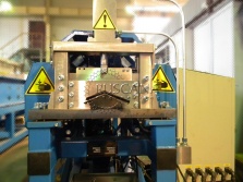 Eave trim roll forming machine